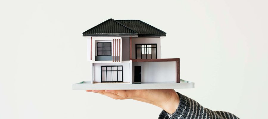 hand-presenting-model-house-home-loan-campaign (1)